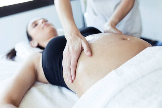 Pregnant lady receiving osteopathic treatment